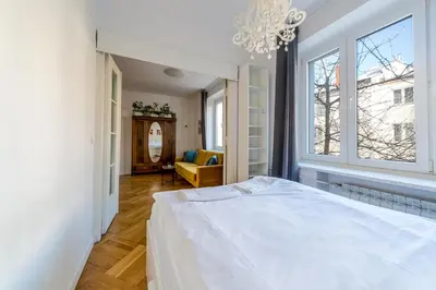 Łóżko lub łóżka w pokoju w obiekcie Warsaw Concierge Dynasy