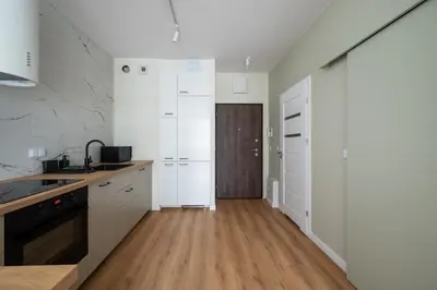 Kuchnia lub aneks kuchenny w obiekcie Business Park Cosy Apartment by BookingHost