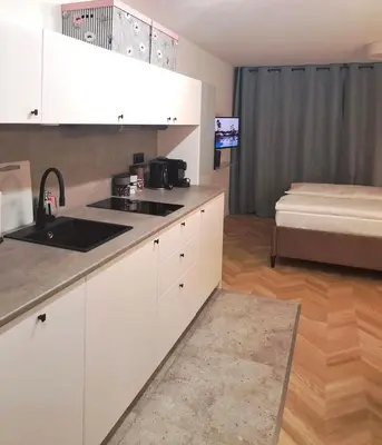 Łóżko lub łóżka w pokoju w obiekcie Falcon Apartment Center 4 Metro Świętokrzyska