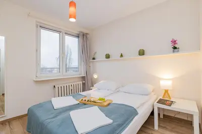 Łóżko lub łóżka w pokoju w obiekcie ShortStayPoland Bonifraterska (B149)