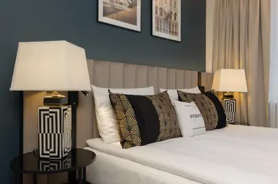 Łóżko lub łóżka w pokoju w obiekcie LUX Blue Moon Residence City Center Foksal by Renters Prestige