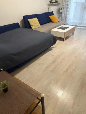 Łóżko lub łóżka w pokoju w obiekcie Apartament Wola City Link 4