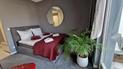 Łóżko lub łóżka w pokoju w obiekcie Apartamenty Wola Tower na Prymasa - z widokiem na City