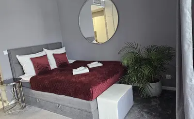 Łóżko lub łóżka w pokoju w obiekcie Apartamenty Wola Tower na Prymasa - z widokiem na City