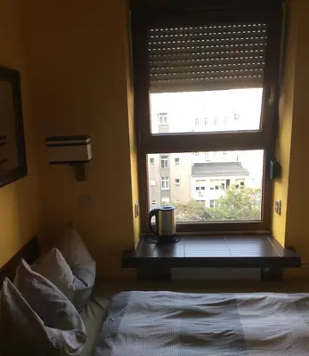 Łóżko lub łóżka w pokoju w obiekcie Chmielna mikro room - Adults Only