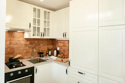 Kuchnia lub aneks kuchenny w obiekcie Jana Pawła 55 - Bardzo wygodne studio w centrum Warszawy - Better Rental