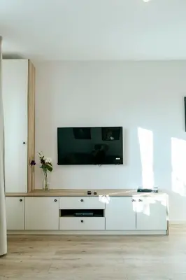 Telewizja i/lub zestaw kina domowego w obiekcie Jana Pawła 55 - Bardzo wygodne studio w centrum Warszawy - Better Rental