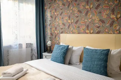 Łóżko lub łóżka w pokoju w obiekcie Park Praski 2-Bedroom Apartment by BookingHost