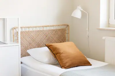 Łóżko lub łóżka w pokoju w obiekcie Warszawa Bright 2-bedroom Apartment by Noclegi Renters