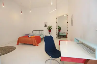 Łóżko lub łóżka w pokoju w obiekcie Pop Apartment Nowogrodzka
