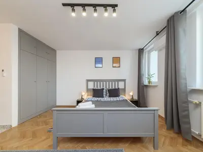 Łóżko lub łóżka w pokoju w obiekcie Metro ONZ apartment/Warsaw central