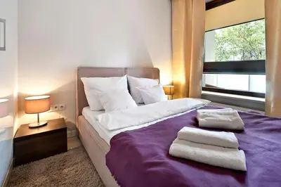 Łóżko lub łóżka w pokoju w obiekcie Gieldowa 4D - One bedroom P&O Serviced Apartments