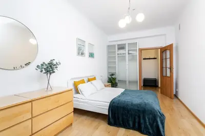 Łóżko lub łóżka w pokoju w obiekcie Coriander Apartment City Center