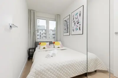 Łóżko lub łóżka w pokoju w obiekcie Elegant & Cozy Apartment Pańska by Noclegi Renters