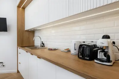 Kuchnia lub aneks kuchenny w obiekcie Wiktoryn 18 Citysphere Premium Suite 1