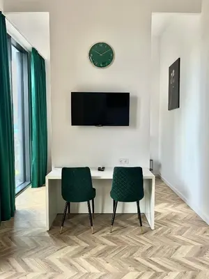Telewizja i/lub zestaw kina domowego w obiekcie Warsaw Concierge Tower