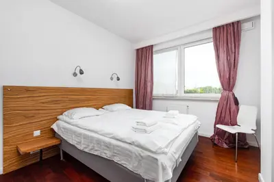 Łóżko lub łóżka w pokoju w obiekcie Skoroszewska 7 by Homeprime