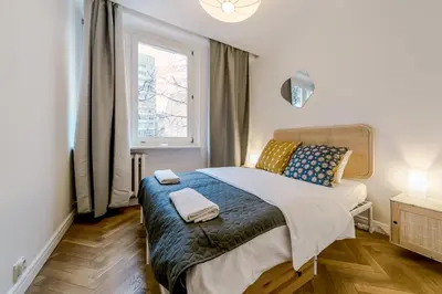 Łóżko lub łóżka w pokoju w obiekcie Warsaw Concierge Opera II