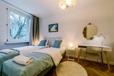 Łóżko lub łóżka w pokoju w obiekcie Warsaw Concierge Opera II