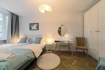 Łóżko lub łóżka w pokoju w obiekcie Warsaw Concierge Opera II
