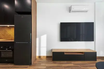 Telewizja i/lub zestaw kina domowego w obiekcie RentPlanet - Apartamenty Wiktoryn