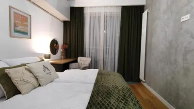 Łóżko lub łóżka w pokoju w obiekcie ApartamentySnu, Wola Premium IV z parkingiem