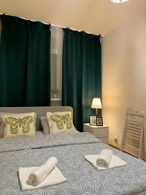 Łóżko lub łóżka w pokoju w obiekcie HALBY rooms Rondo ONZ