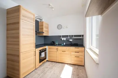 Kuchnia lub aneks kuchenny w obiekcie Krzyżówki Comfort Apartment by BookingHost