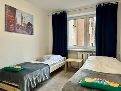 Łóżko lub łóżka w pokoju w obiekcie Apartament Stadion naprzeciwko Stadionu Narodowego w Warszawie