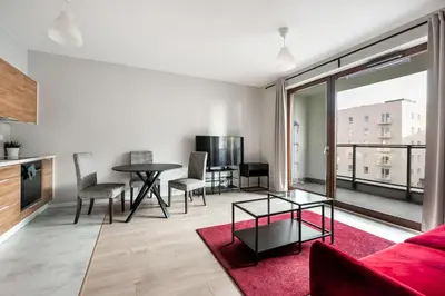Telewizja i/lub zestaw kina domowego w obiekcie Białej Floty Red Apartment by BookingHost