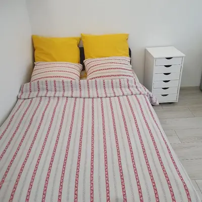 Łóżko lub łóżka w pokoju w obiekcie Krucza Apartament