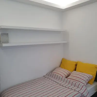 Łóżko lub łóżka w pokoju w obiekcie Krucza Apartament