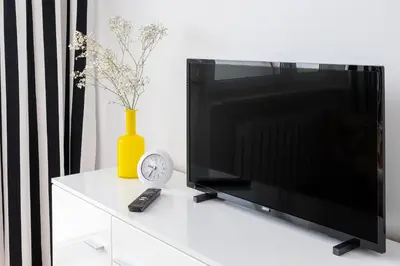 Telewizja i/lub zestaw kina domowego w obiekcie Praga Łukowska Cosy Apartment by BookingHost