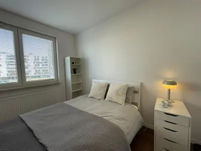 Łóżko lub łóżka w pokoju w obiekcie IkigaiHome PL modern apartment with garage