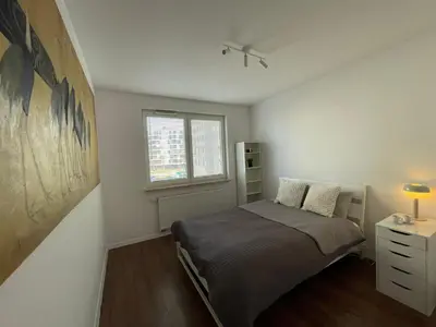 Łóżko lub łóżka w pokoju w obiekcie IkigaiHome PL modern apartment with garage