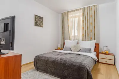 Łóżko lub łóżka w pokoju w obiekcie P&O Apartments Niemcewicza