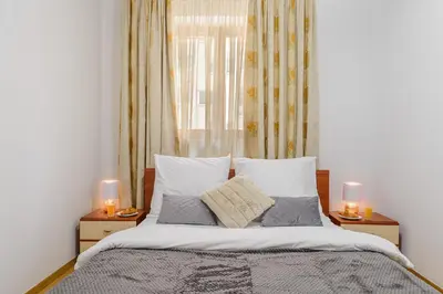 Łóżko lub łóżka w pokoju w obiekcie P&O Apartments Niemcewicza
