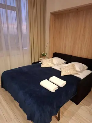 Łóżko lub łóżka w pokoju w obiekcie Zlatarooms