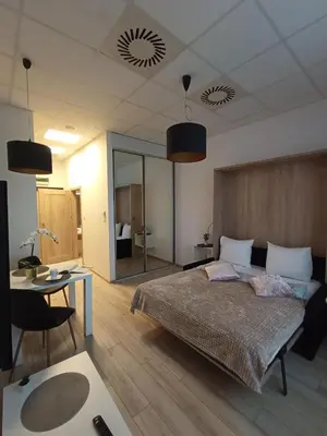 Łóżko lub łóżka w pokoju w obiekcie Zlatarooms