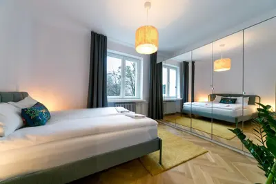 Łóżko lub łóżka w pokoju w obiekcie Warsaw Concierge Polin II