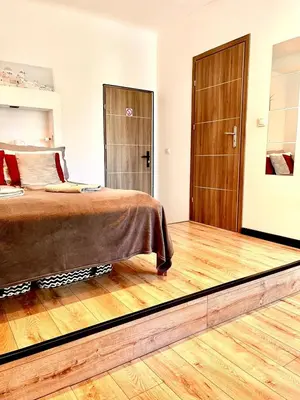 Łóżko lub łóżka w pokoju w obiekcie Nice 1Room Condo WarszawaCenter