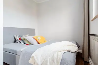 Łóżko lub łóżka w pokoju w obiekcie Apartament na Powiślu