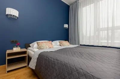 Łóżko lub łóżka w pokoju w obiekcie 2 Bedroom Apartment Beautiful Green Surroundings Międzyborska Street by Noclegi Renters