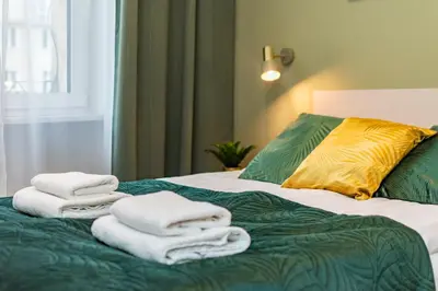 Łóżko lub łóżka w pokoju w obiekcie Aleje Jerozolimskie 42 by Homeprime