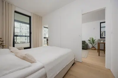 Łóżko lub łóżka w pokoju w obiekcie Stylish Grzybowska Apartments by Noclegi Renters