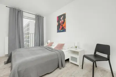 Łóżko lub łóżka w pokoju w obiekcie Modern Targowek Apartment by Noclegi Renters