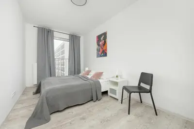 Łóżko lub łóżka w pokoju w obiekcie Modern Targowek Apartment by Noclegi Renters