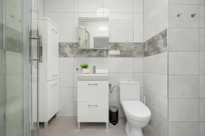 Łazienka w obiekcie Modern Targowek Apartment by Noclegi Renters