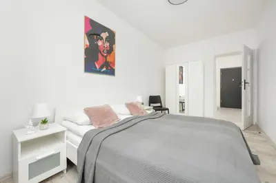 Łóżko lub łóżka w pokoju w obiekcie Modern Targowek Apartment by Noclegi Renters
