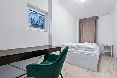 Łóżko lub łóżka w pokoju w obiekcie RentPlanet - Apartament Muranów